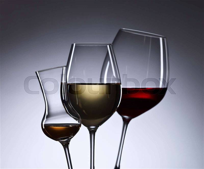Closeup of glasses with red and white wine, stock photo