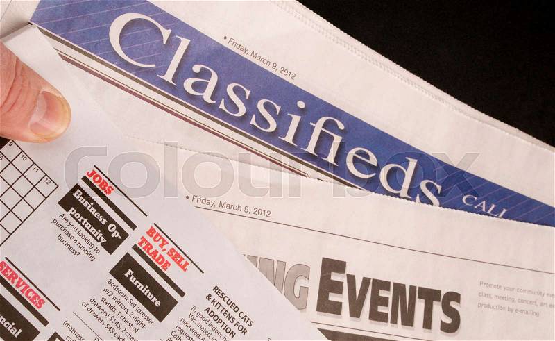 Classified Help Wanted Job Offered Ads in Traditional Print Newspaper, stock photo