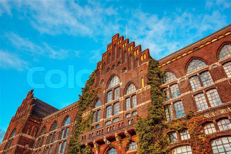 Lund University Library. An huge brick facade with ivy against blue sky, Sweden, Nov 8, 2016,, stock photo