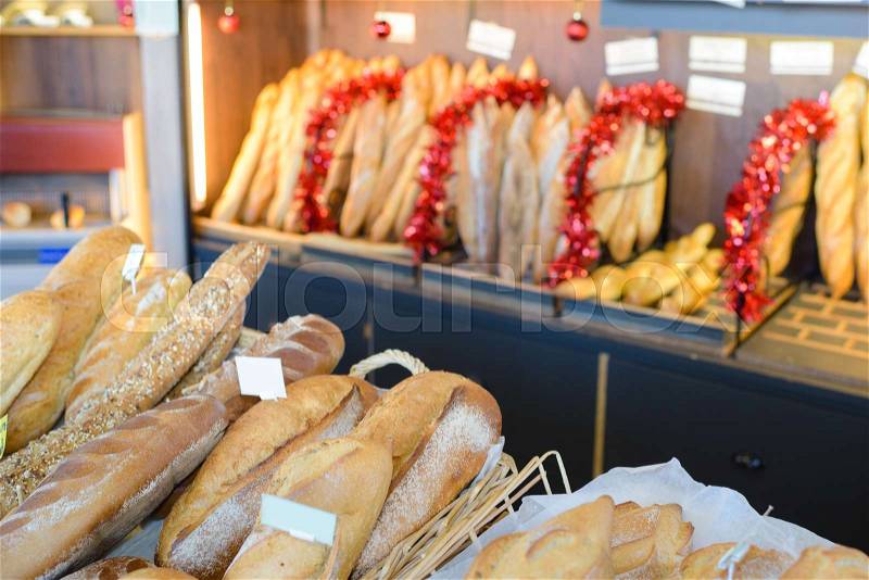 Bread displayed in french bakery, stock photo