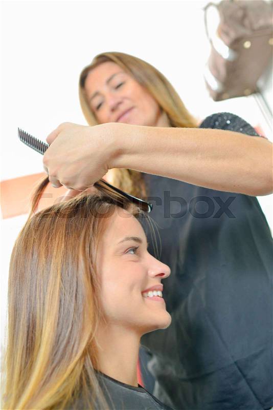 Lady having hair done, stock photo