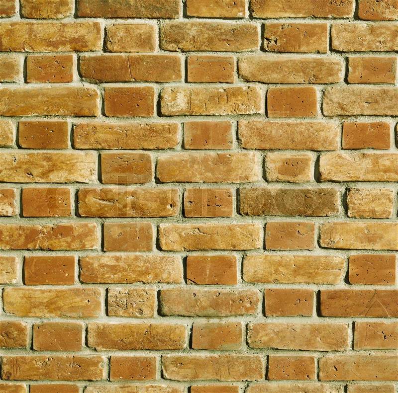 Part of building ,texture with old bricks ,natural golden sunlight, focus point on center, stock photo