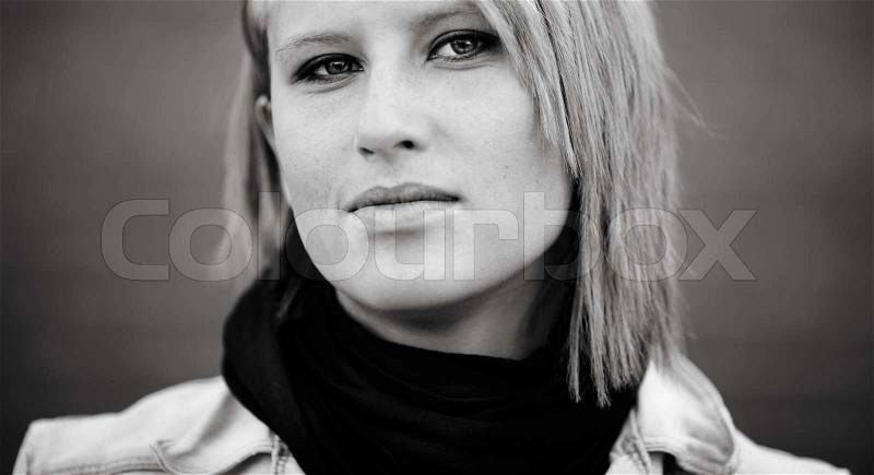 Close-up of blond young woman ,urban portrait, natural light, stock photo