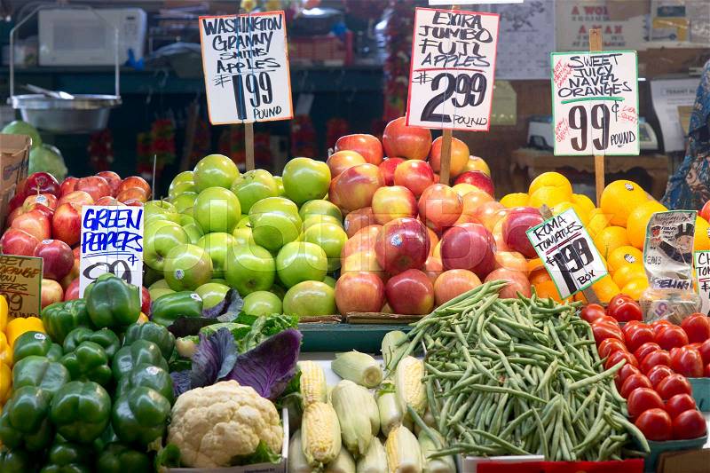 A vendor displays her food produce at the Pike Place Public Market in Seattle, stock photo