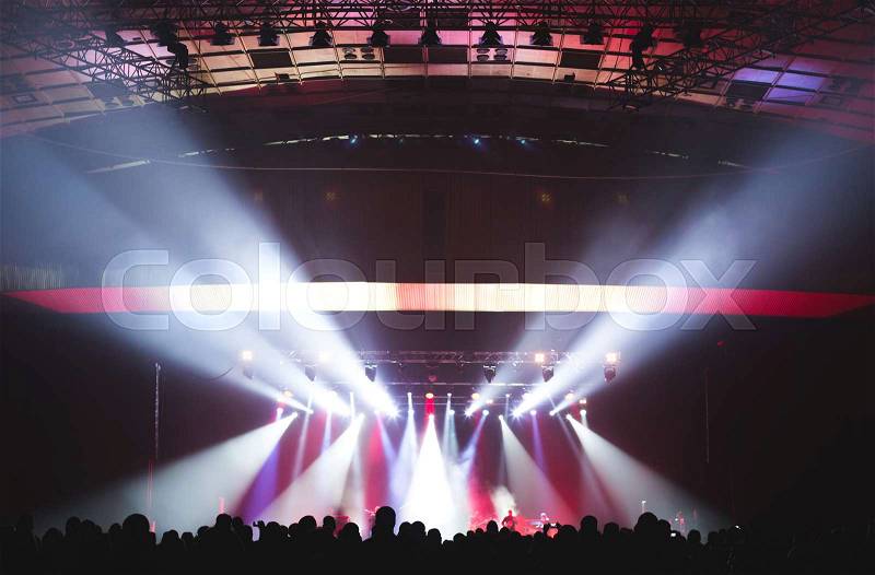 Large concert hall filled with spectators before the stage, stock photo