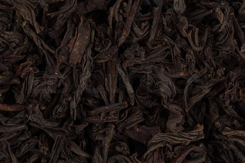 Black dry tea leaves close up for background, stock photo