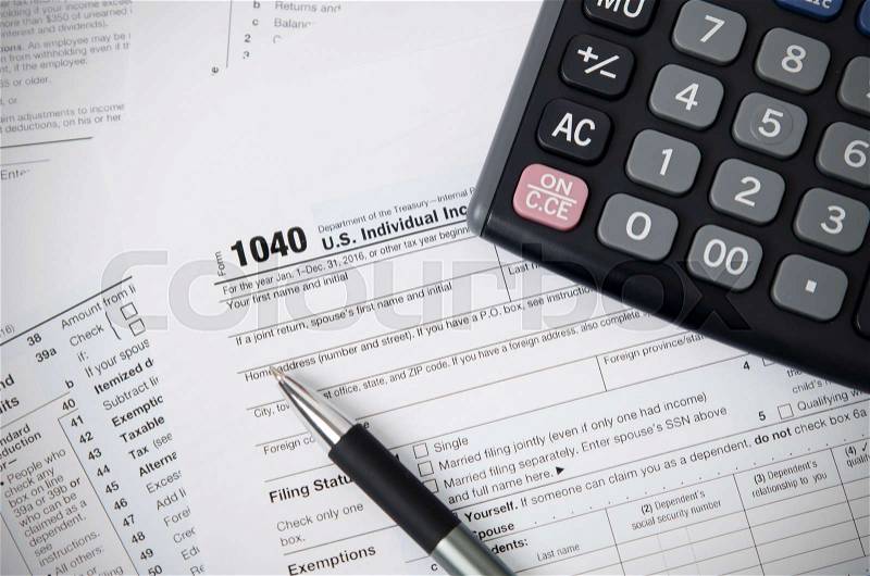 US tax form 1040 with pen and calculator. tax form law document usa white mathematics business concept, stock photo