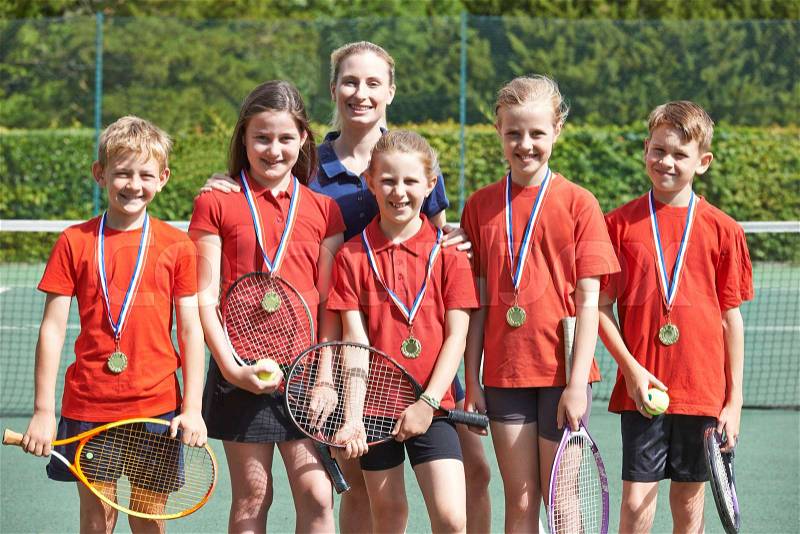 Victorious School Tennis Team With Medals , stock photo