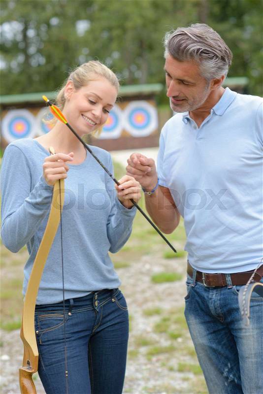 Teaching to place the arrow, stock photo