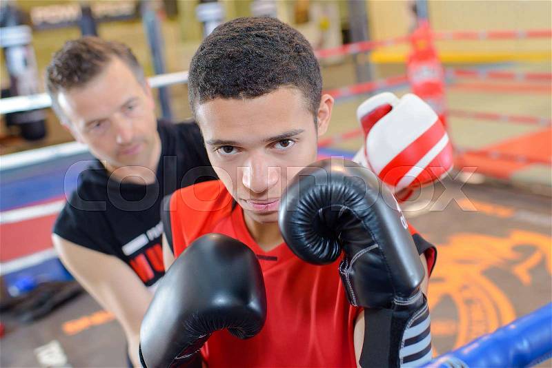 Young man in boxing ring, stock photo