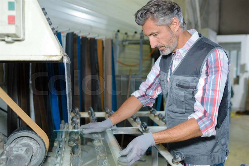 Fixing a roller machine, stock photo