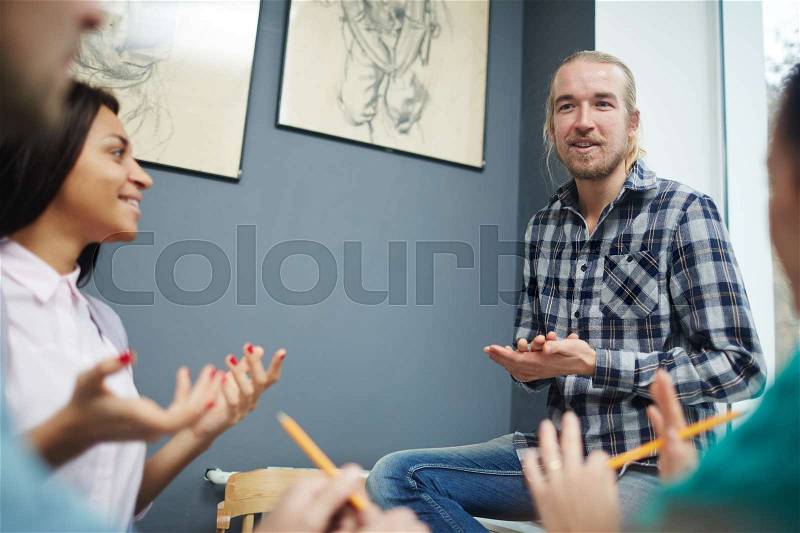 Young staff discussing business strategies, stock photo