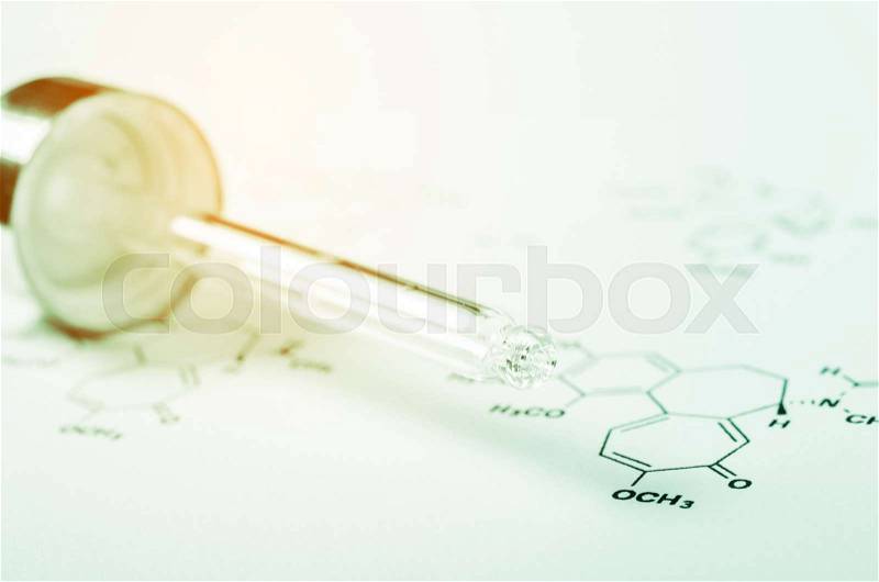 Laboratory glass Pipette on Chemical formula paper with light tone select focus, stock photo