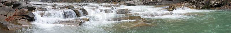 Panorama view of autumn mountain river with waterfall, stock photo