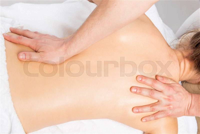 Massage technique stretching back women in the salon, stock photo