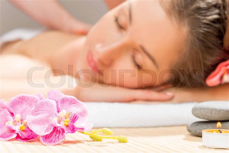 Focus on the flowers of orchids on the table in cabinet spa, stock photo