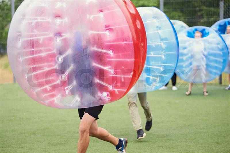 Bubble bump. Team game outdoor. Fun for teenagers, stock photo