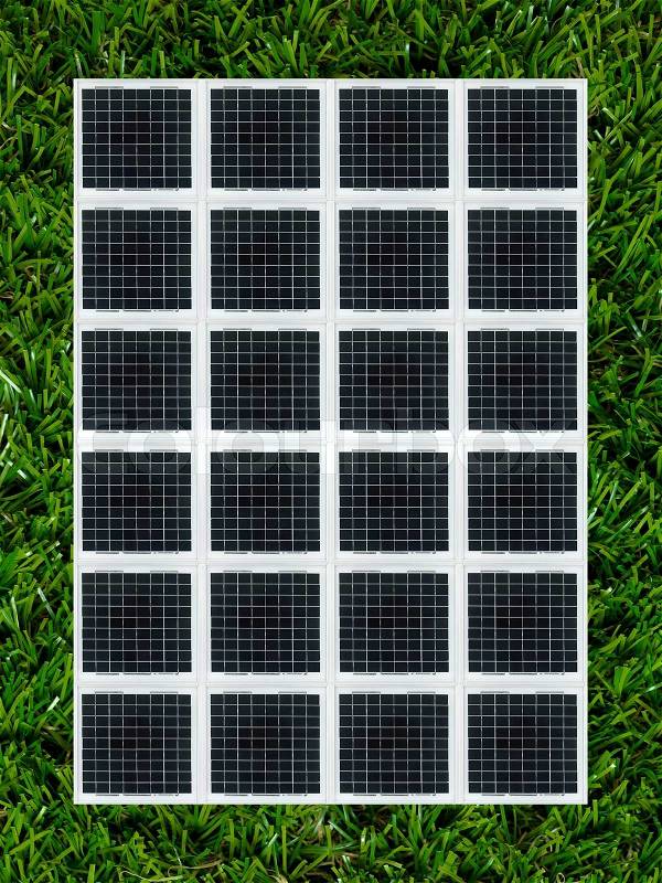 Conceptual renewable images isolated against artificial lawn, stock photo