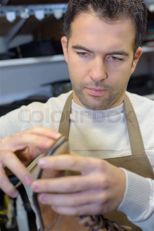 Mending the sole, stock photo