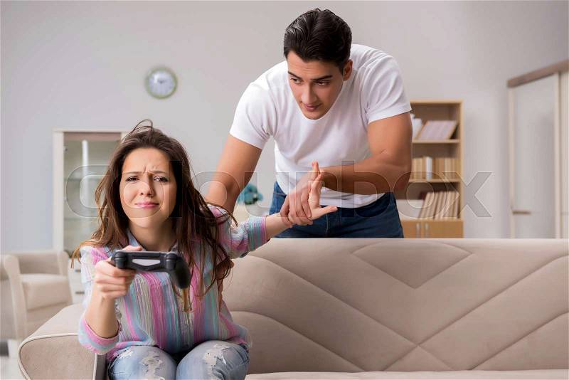 Young family suffering from computer games addiction, stock photo