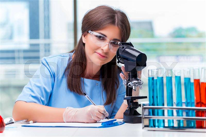 Young woman working in the laboratory, stock photo