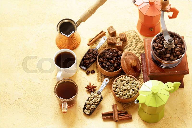 Still life of coffee - green and brown beans and spices, cinnamon and anise, stock photo