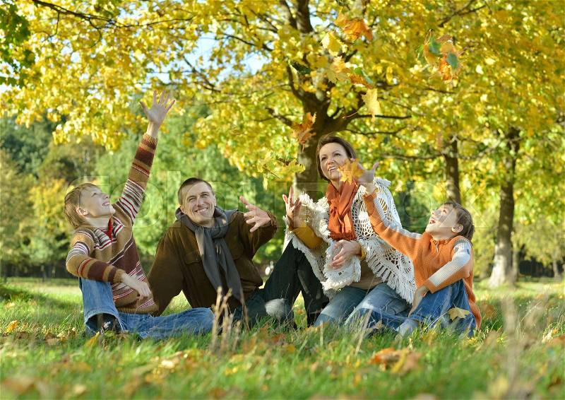 Big happy family posing outdoors in autumn, stock photo