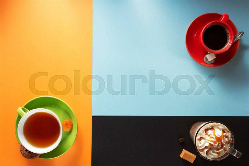 Cup of coffee and tea at colorful background, stock photo