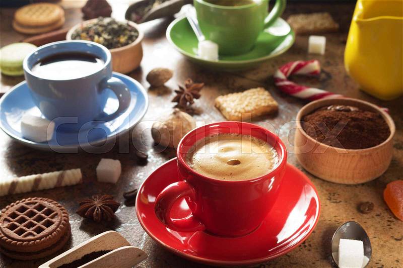 Cup of coffee, tea and cacao at table background, stock photo
