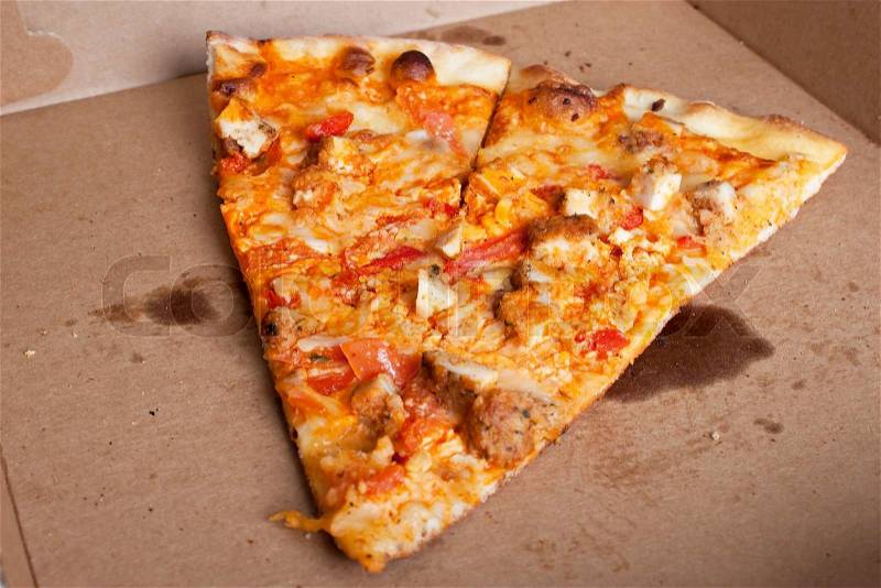 A few slices of buffalo chicken pizza left in the box The perfect weekend take out dinner, stock photo