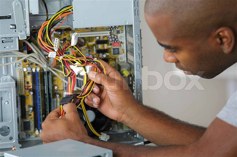 Electrician holding cables, stock photo