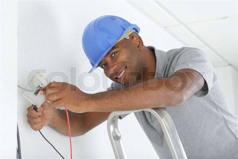 Portrait of electrician wiring, stock photo