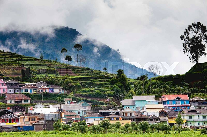 Landscape with village, mountains and mist,Indonesia, stock photo