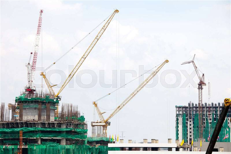 Industrial construction Cranes on a construction site, stock photo