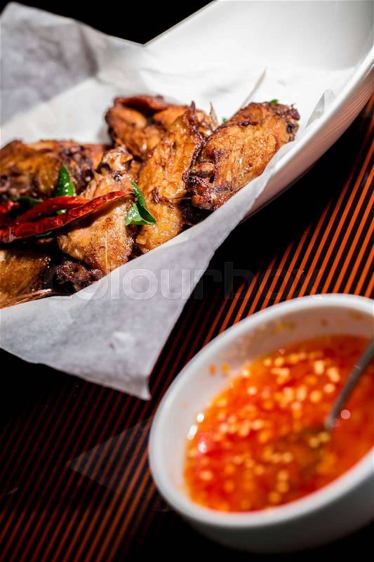 Fried Chicken Wings on dish in dinner, stock photo