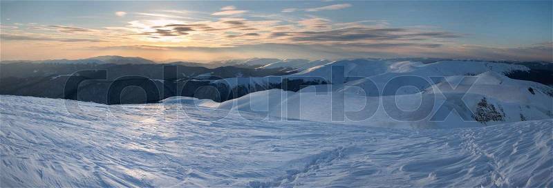 Beautiful mountain sunset landscape with sun way on ice-coated mountainside (Ukraine, Carpathian Mt\'s, Svydovets Range) Three shots stitch image, stock photo