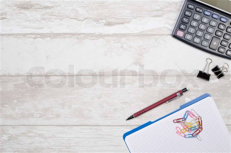 Business desk in office top view. Table with calculator, notepad, and office supplies. Copy space website banner concept, stock photo