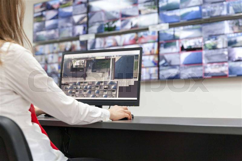 Security system operator. Control room, stock photo
