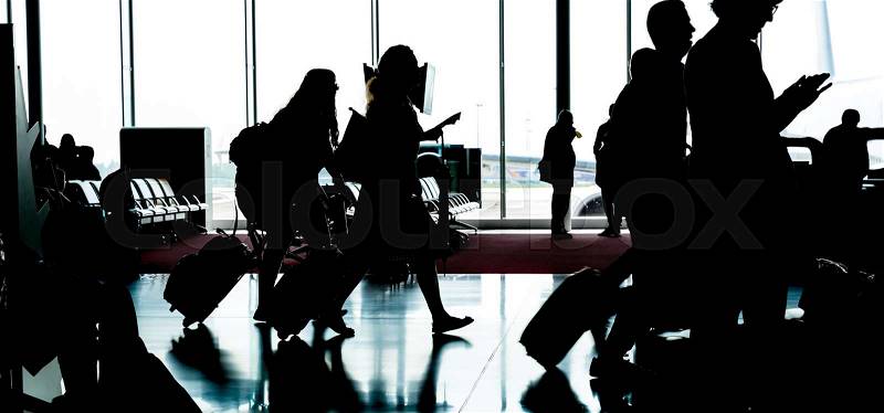 People with luggage go to registration in airport. Travel or tourism concept, stock photo