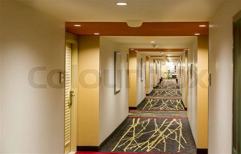 Hotel corridor interior with carpet. Empty hotel hallway, stock photo