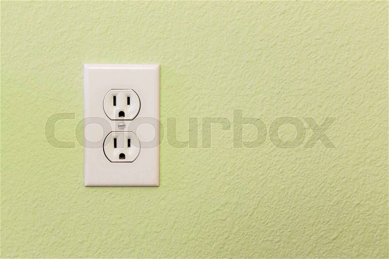Electrical Sockets In Colorful Wall of House, stock photo