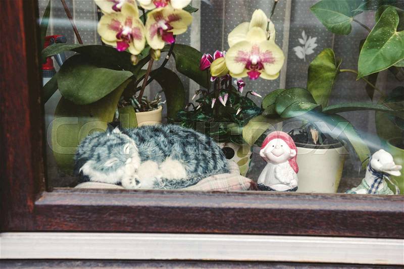Vintage cat toy decorating the windov of a house in Baden-Baden, Germany, stock photo