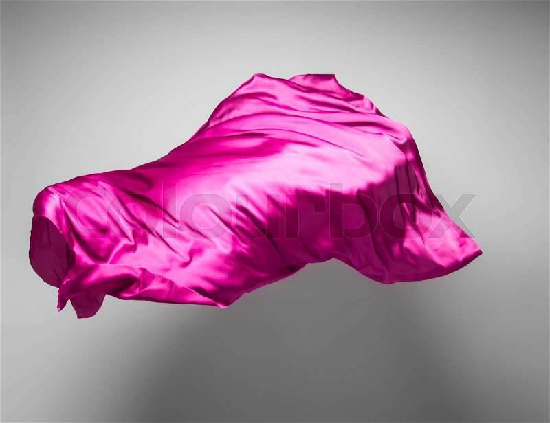 Piece of purple fabric flying - abstract art object, design element, stock photo