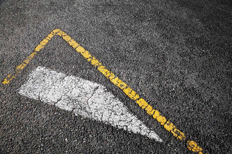 Road marking, white stripe and corner of yellow borders line over black asphalt pavement, background photo, stock photo