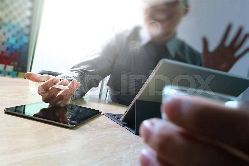 Business team meeting present. Happy professional investor working with new start up project. Digital tablet laptop computer design smart phone using, keyboard docking screen,sun flare, stock photo
