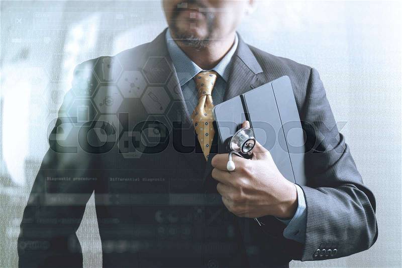Smart medical doctor holding digital tablet computer,stethoscope,front view,filter effect,business strategy icons interface, stock photo