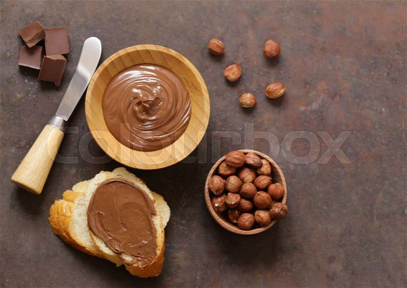 Chocolate paste spread with hazelnuts and bread for breakfast, stock photo