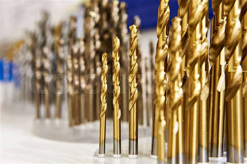 Set of drill bits for metal and wood in the shop, stock photo