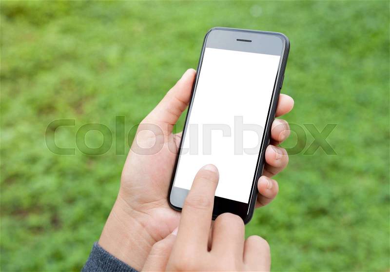 Close-up hand touch on phone mobile screen outdoor lifestyle concept, stock photo