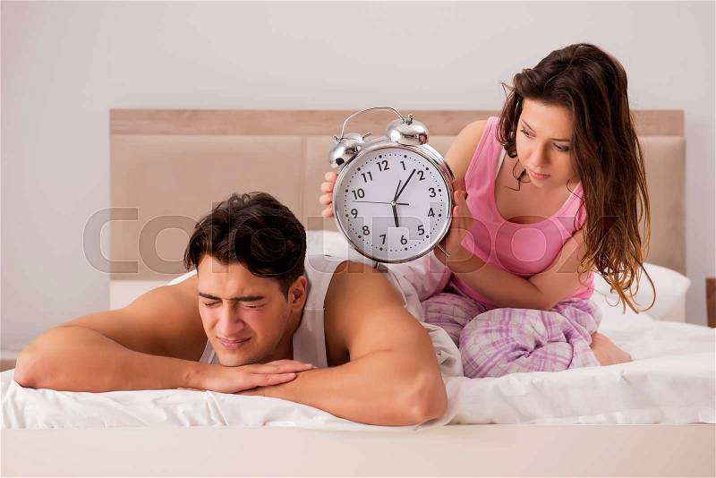 Family conflict with wife husband in bed, stock photo